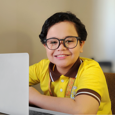 Young learner showing colorful painted hands